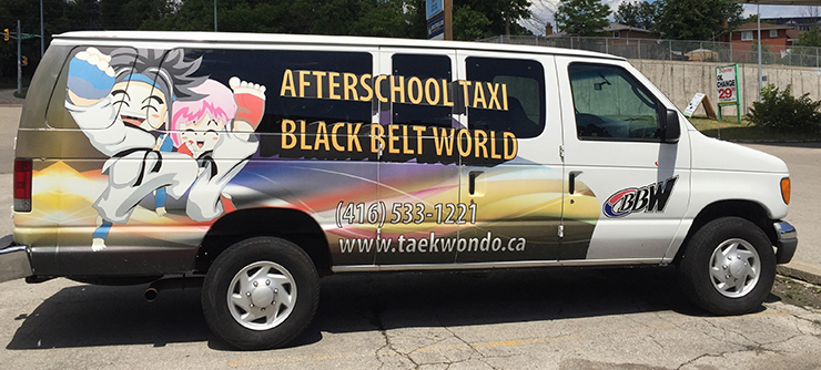 A branded Black Belt World van offering an after school program with professional taekwondo lessons.